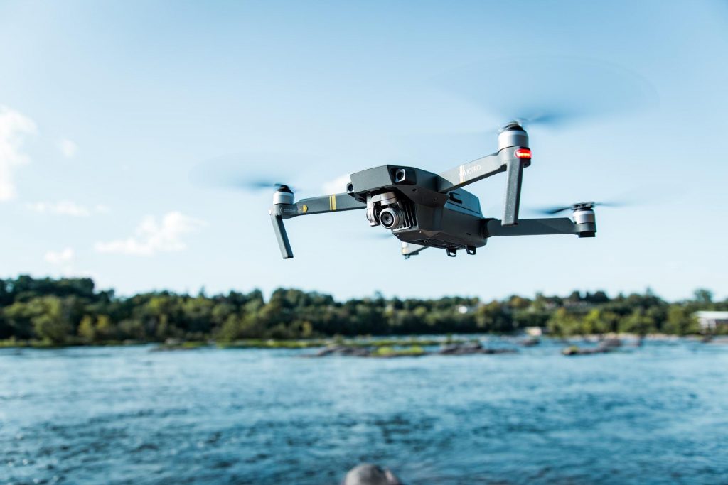 A drone flying over a body of water