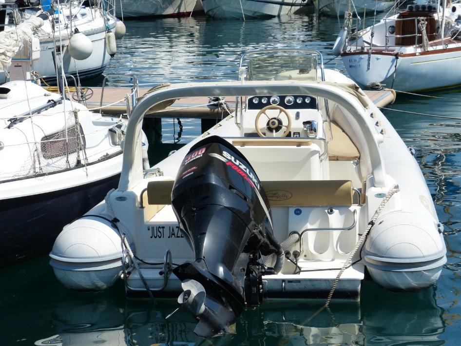 Boat outboard motor in the water