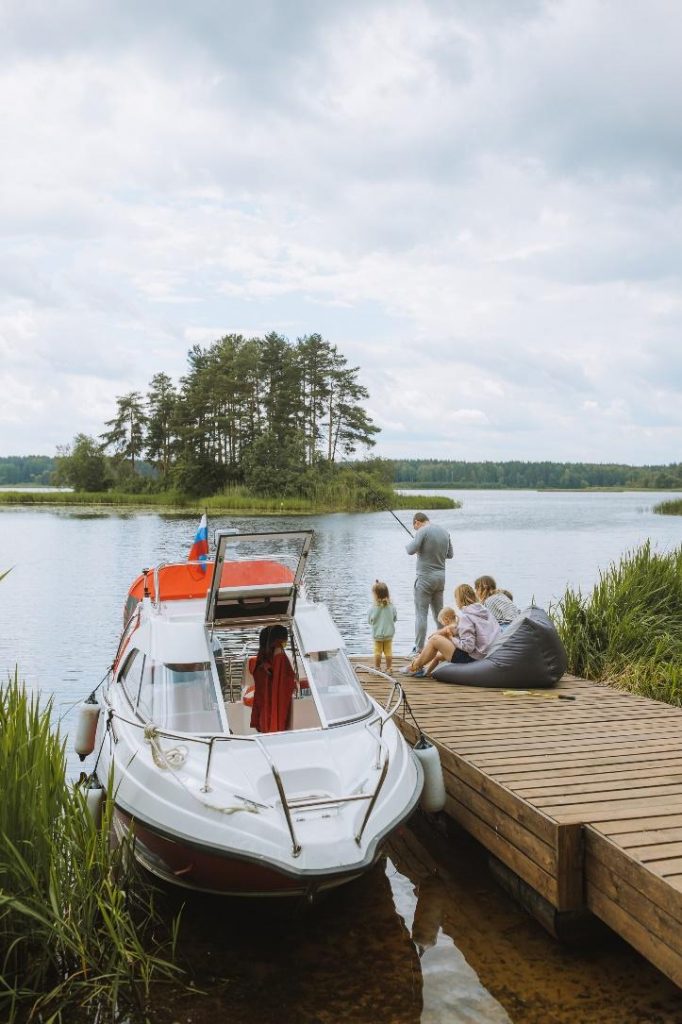 Family fishing trip with a boat in summer