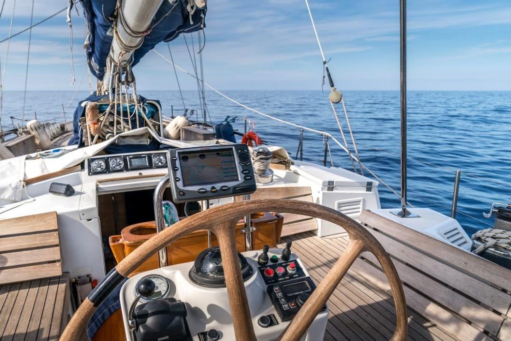 Sail boat helm with a view of the sea
