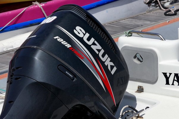 Suzuki outboard motor seen in lifted position