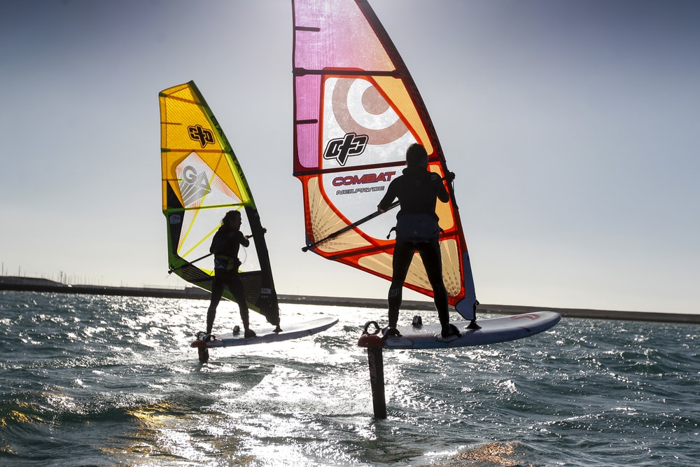 windsurfers on foils