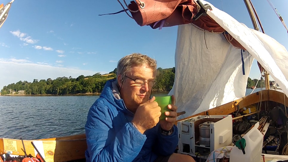 Steve drinking his tea from his boat