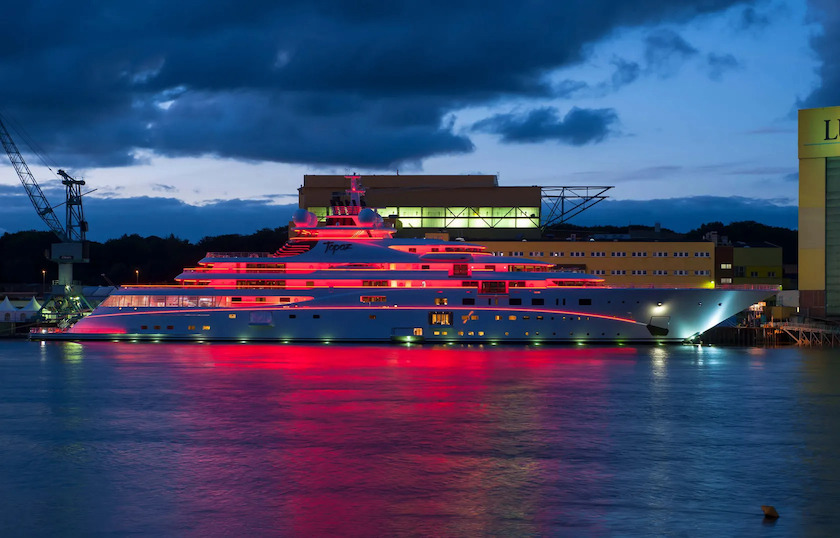 Yacht illuminated pink at night