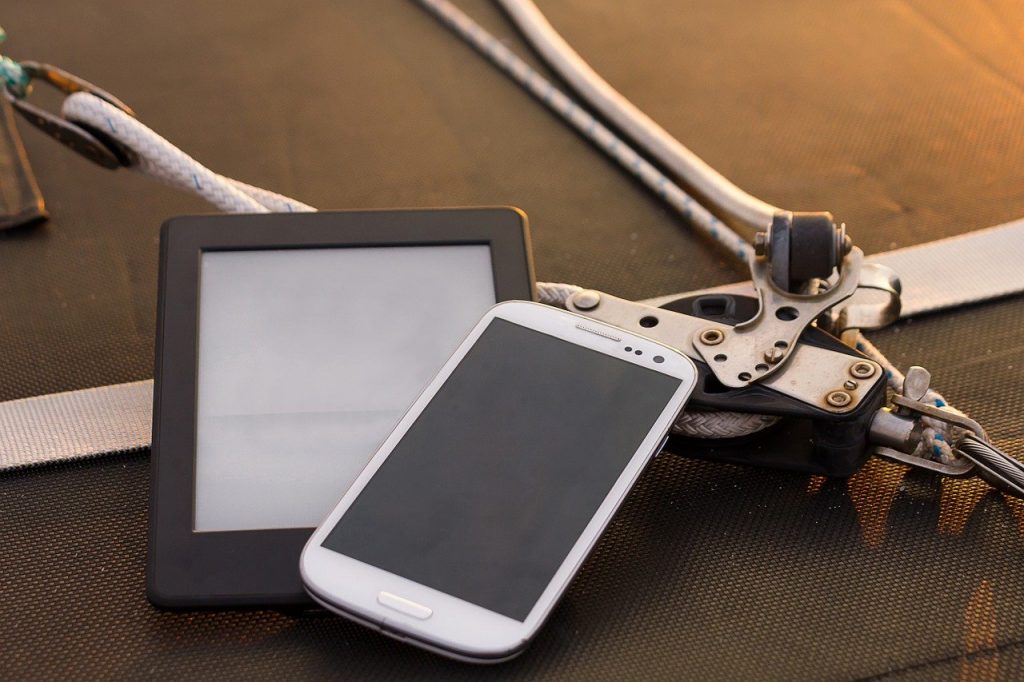 Phone and e-reader on a boat 