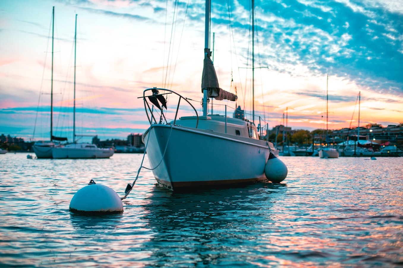 boat attached to mooring buoy