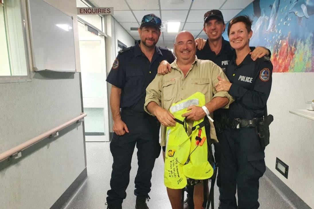 Nigel stood with the NT Police who came to his rescue