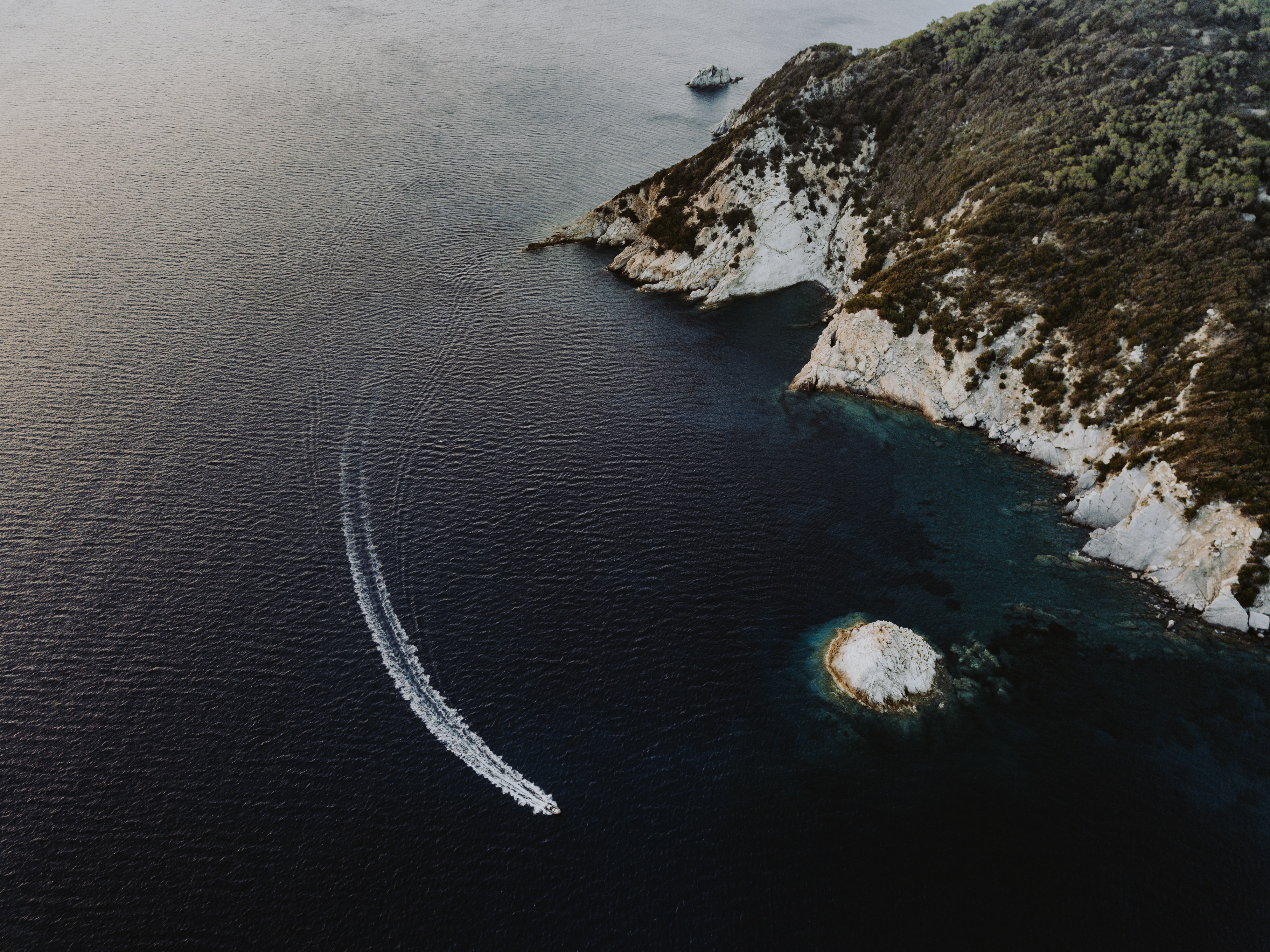 Drone shot of a boat in Elba Italy